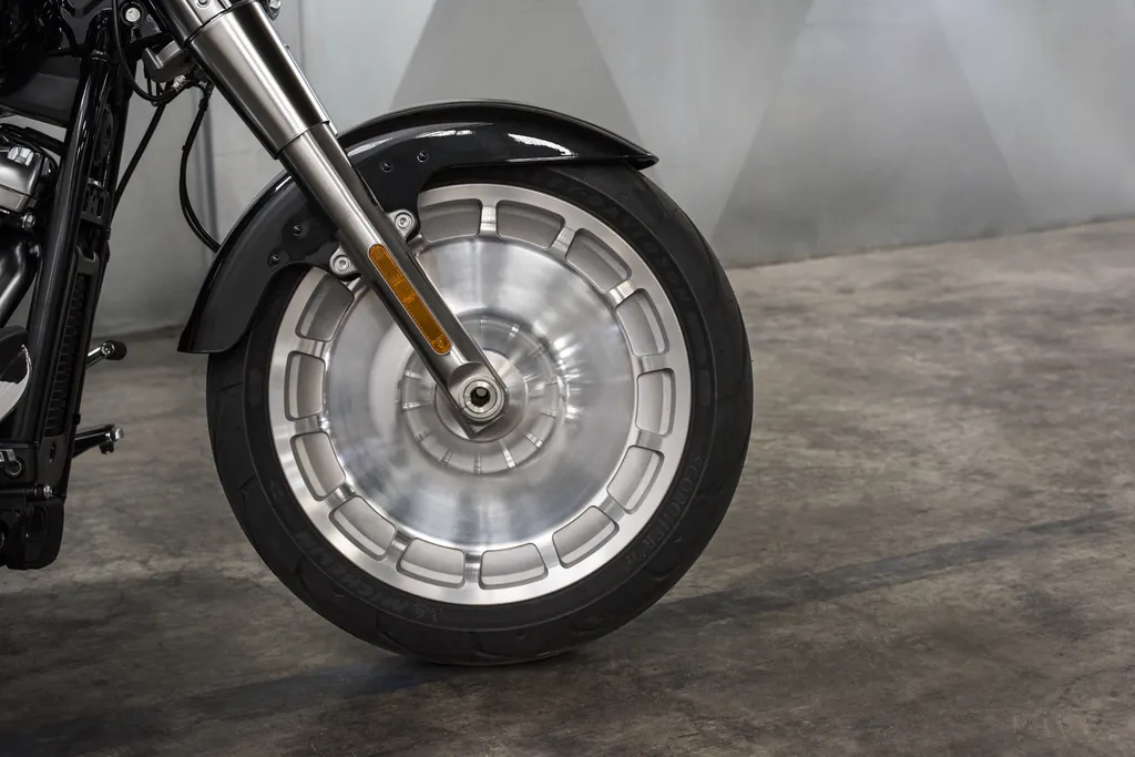 Close-up of the solid disc front wheel and tyre on a 2018 Harley-Davidson Fat Boy