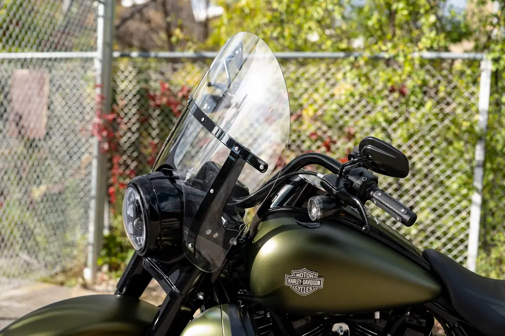 Harley-Davidson Road King Special with an olive tank and a detachable windshield fitted, outdoors